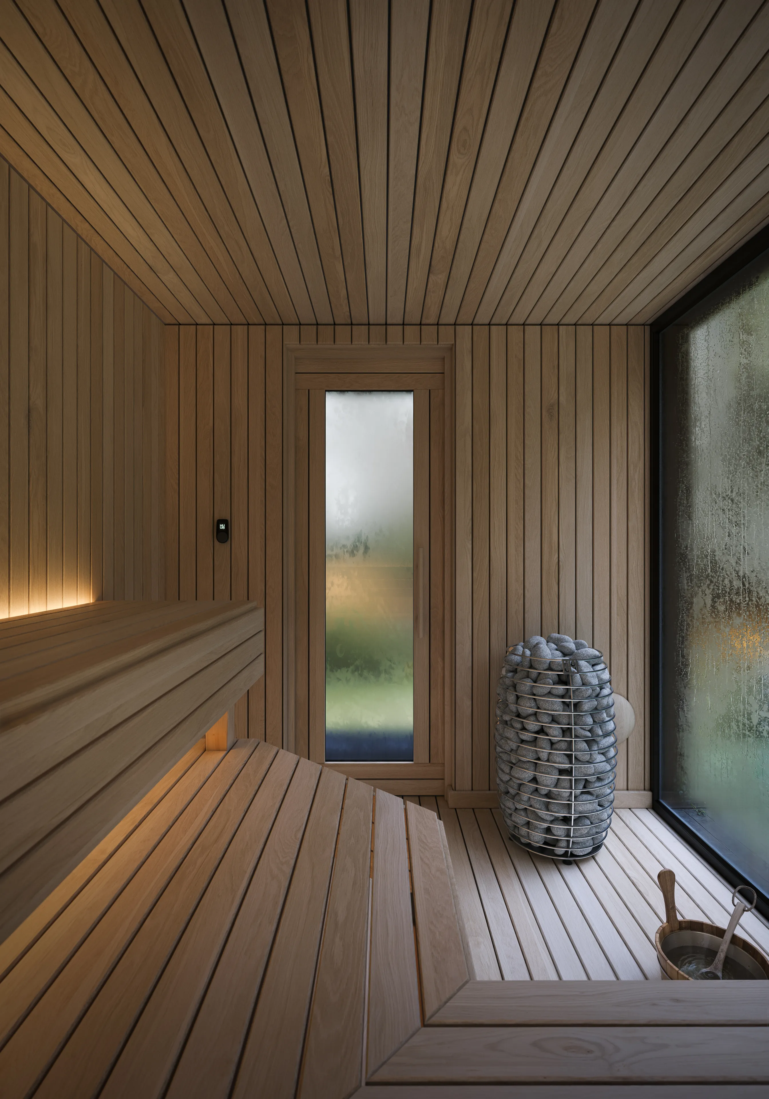 HUUM Drop 6 kW heater with olivine stones, the UKU control and a frosted door beyond